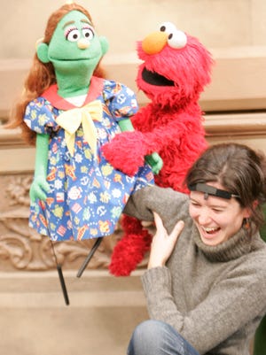 USA TODAY's Olivia Barker tried her hand at puppeteering on 'Sesame Street' in 2004.