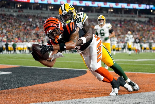 Aug. 11: Cincinnati Bengals wide receiver Andrei Iosivas (80) tries to come down with a catch in the end zone as Green Bay Packers cornerback William Hooper (27) defends. The pass was ruled incomplete.