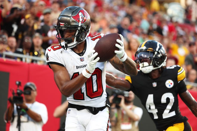 Aug 11: Tampa Bay Buccaneers wide receiver Trey Palmer (10) catches the ball for a touchdown as Pittsburgh Steelers cornerback James Pierre (42) tries to defend.