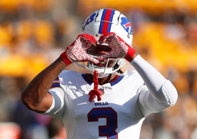 Aug. 19: Buffalo Bills safety Damar Hamlin makes a heart with his hands during warm-ups before the game against the Pittsburgh Steelers.