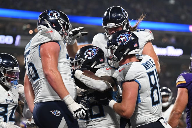 Aug 19: Tennessee Titans players celebrate after scoring a touchdown against the Minnesota Vikings.