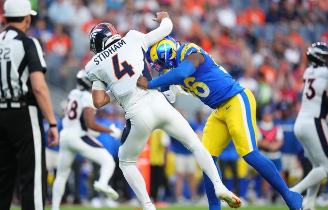 Aug. 26: Los Angeles Rams linebacker Keir Thomas hits Denver Broncos quarterback Jarrett Stidham in the first quarter.