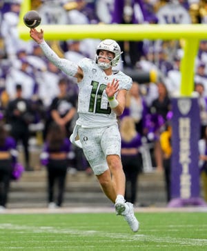 Oregon quarterback Bo Nix throws against Washington during the first half of the game Saturday, Oct. 14, 2023, in Seattle.