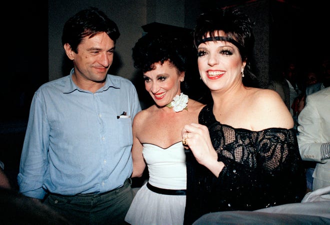 Liza Minnelli, left, Chita Rivera, center and Robert De Niro, during a party Minnelli hosted to honor Rivera for winning the best actress Tony Award for "The Rink" on June 9, 1984, in New York.
