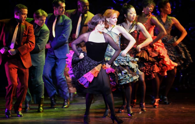 Chita Rivera dances with others on stage during a dress rehearsal to her career-spanning Broadway show, "The Dancer's Life," at the Schoenfeld Theatre in New York on Nov. 22, 2005.