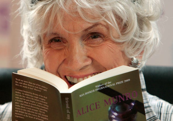 Canadian author Alice Munro holds one of her books as she receives her Man Booker International award at Trinity College Dublin, in Dublin, Ireland, on June 25, 2009. Nobel Prize-winning Munro died on May 13, 2024, at the age of 92, Canadian media reported on May 14.