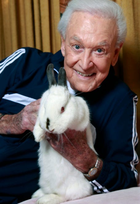 Barker holds 8-year-old Mr. Rabbit at their Los Angeles home on Dec. 13, 2011.