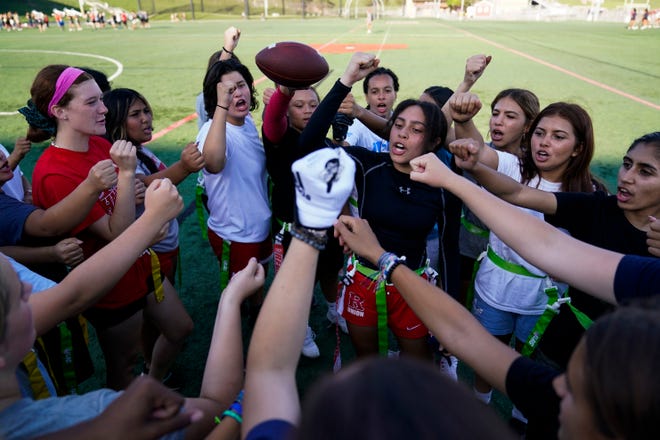 Elsa Morin, 17, center right, leads a chant as Redondo Union High School girls try out for a flag football team on Thursday, Sept. 1, 2022, in Redondo Beach, Calif. Officials in the southern section of the California Interscholastic Federation will meet on Thursday, Sept. 29, to consider making girls flag football an official high school sport amid growth in the sport at the collegiate level and a push by the NFL to increase interest. Read more: California eyes making girls flag football official high school sport as it soars in popularity